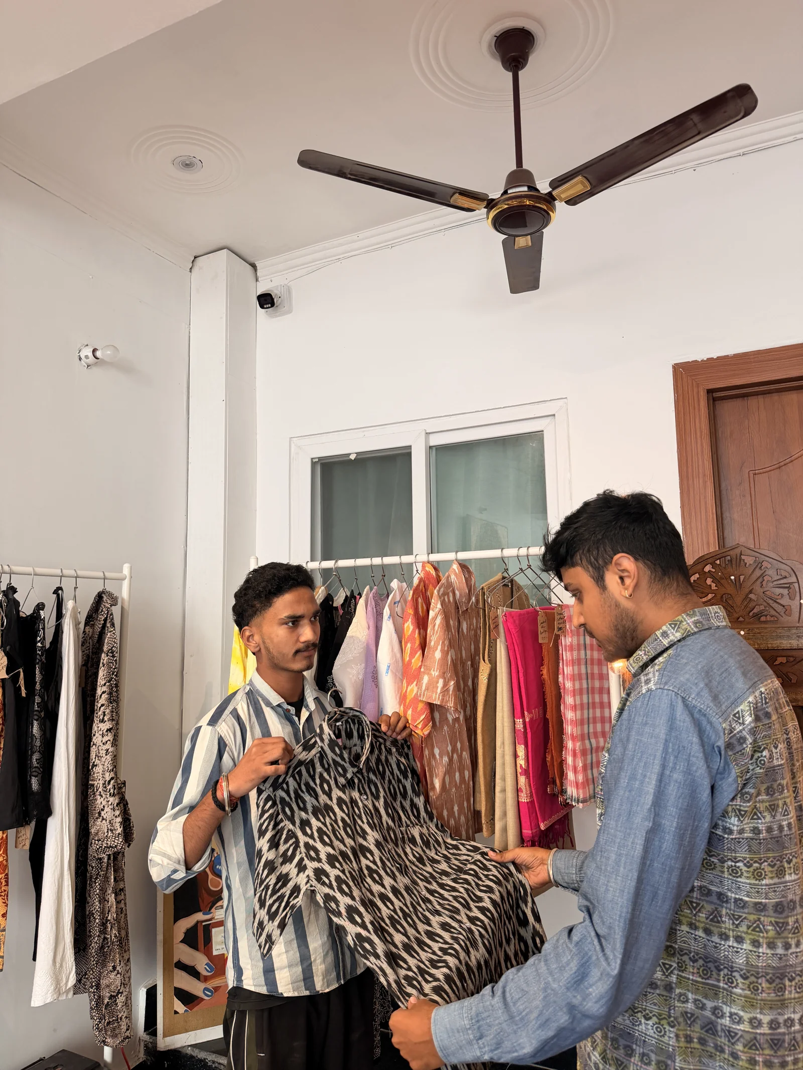 Guests browsing the clothing rail in the Sanskriti lounge