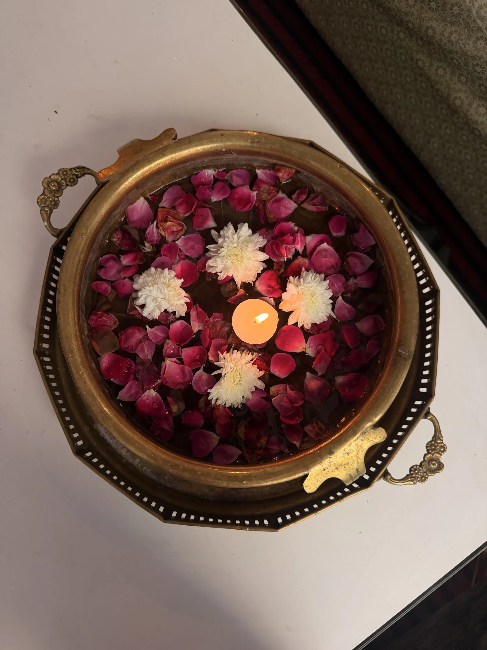 Fresh flowers arranged in a brass bowl at Sanskriti
